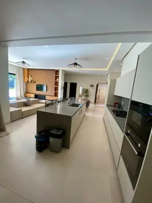 a large kitchen and living room in a house at Villa P1 avec Piscine Chauffée in Marrakech