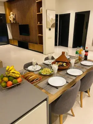 a table with plates of food on top of it at Villa P1 avec Piscine Chauffée in Marrakech
