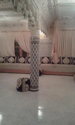 a room with beds and a pillar in a room at fes in Fès