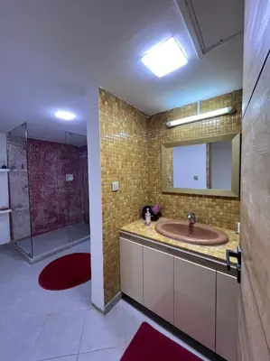 a bathroom with a sink and a shower at Ghali Appart in Fès