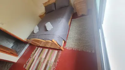 a small bed sitting on the floor in a room at Tayda Guest House in Azilal