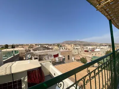 a view of a city from a balcony at Dar Zarbtana Chambre Essaouira in Fès