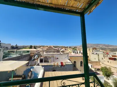 a view of a city from a balcony at Dar Zarbtana Chambre RADIA in Fès