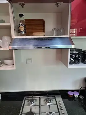 a kitchen with a stove and a counter top at Appartement Jasmine Atlas Center in Fès