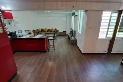 a living room with a couch and a table at Appartement Jasmine Atlas Center in Fès