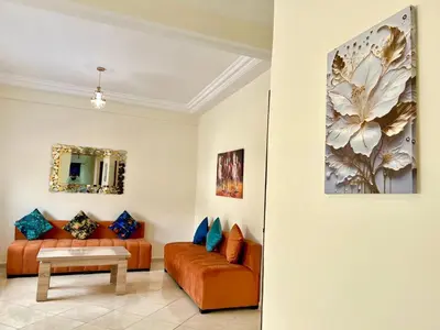 a living room with a couch and a table at Appart Hotel Fes - Joud Families & Travelers in Fès