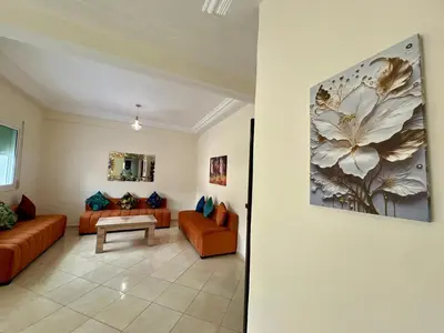 a living room with two couches and a table at Appart Hotel Fes - Joud Families & Travelers in Fès