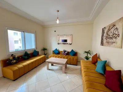 a living room with two couches and a table at Appart Hotel Fes - Joud Families & Travelers in Fès