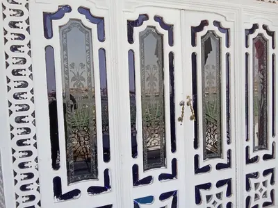 a white door with a bunch of windows at Double room in Fès