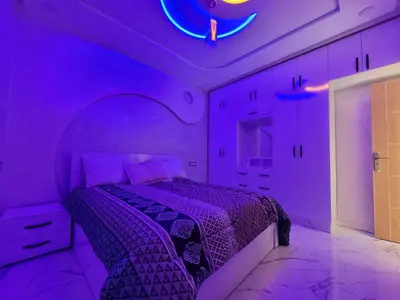 a purple bedroom with a bed and a purple ceiling at Bella nova in Azrou