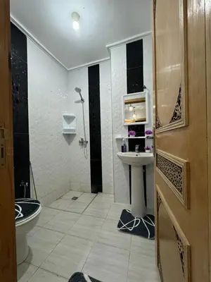 a bathroom with a shower and a sink and a toilet at Mohammed zerrifi in Fès
