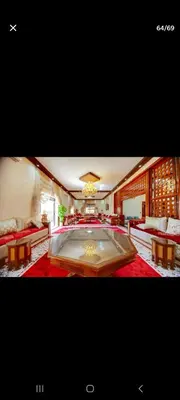 a large room with a large pool in the middle of it at Zaouiet ben sassi in Marrakech