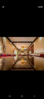 a hallway with two beds in a hotel room at Zaouiet ben sassi in Marrakech