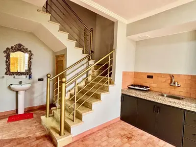 a bathroom with a staircase with a sink and a sink at Cabanne ourika in Marrakech