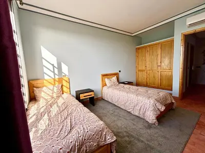 a bedroom with two beds at Cabanne ourika in Marrakech