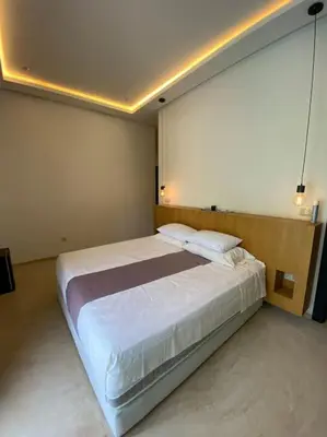 a bedroom with a large bed in a room at Villa P5 avec piscine chauffée in Marrakech