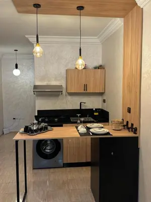 a kitchen with a stove and a counter top at Atlas appartement in Fès