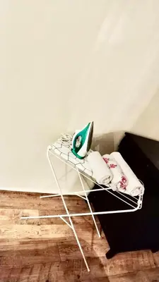 a white table with a laptop on top of it at Atlas appartement in Fès