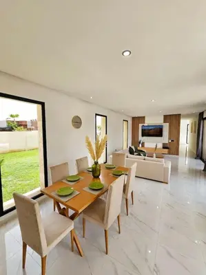 a dining room with a table and chairs and a couch at Villa Piscine Sans Vis à Vis in Marrakech
