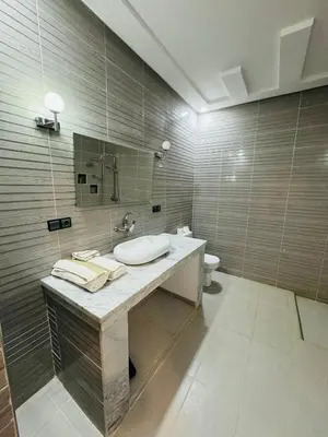 a bathroom with a sink and a toilet at Riad Kasbah Ben Hamo in Nkob