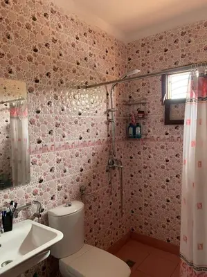 a bathroom with a toilet and a sink and a shower at Séjour Authentique à Marrakech in Marrakech