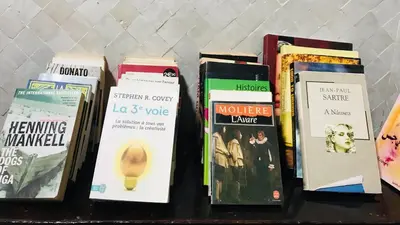 a group of books sitting on a table at Riad Zahraa Al Ismailia in Meknès
