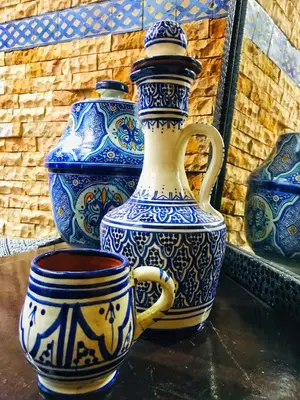 three blue and white vases sitting on a table at Riad Zahraa Al Ismailia in Meknès
