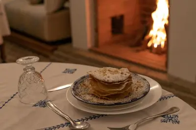 a piece of cake on a plate on a table at Riad Louna Fes & Spa in Fès