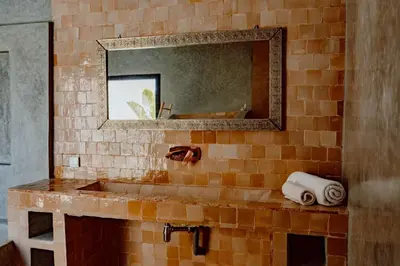 a bathroom with a sink and a mirror at Villa de luxe in Marrakech