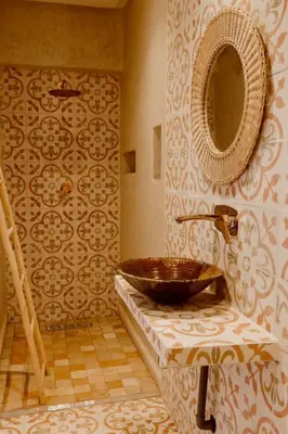 a bathroom with a sink and a mirror at Villa de luxe in Marrakech