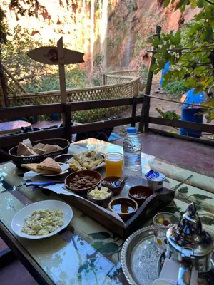 a table with a tray of food and drinks on it at Tikida house in Ouzoud