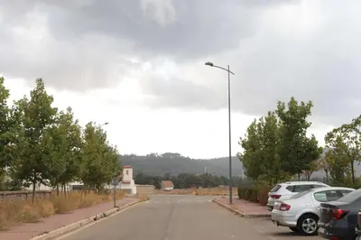 a street with cars parked in a parking lot at Jolie appartement à Ifrane calme et spacieux in Ifrane