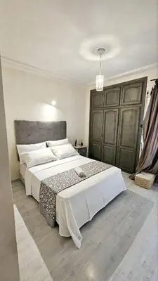a bedroom with a large bed in a room at Maison Chafik in Fès