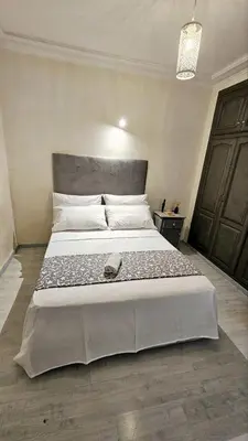 a bedroom with a large bed with a large bed sidx sidx sidx at Maison Chafik in Fès