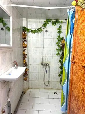 a bathroom with a shower and a sink at Blue Star Hostel in Fès
