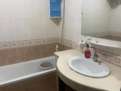a bathroom with a sink and a bath tub at Meknes in Meknès