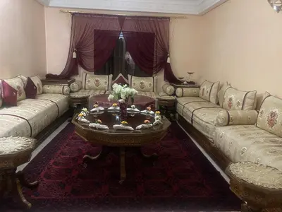 a living room with couches and a coffee table at Meknes in Meknès