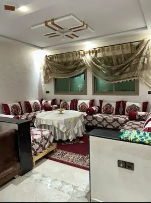 a living room with a couch and a table at بدون اسم in Fès