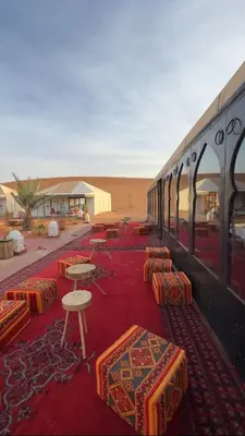 a train parked in the middle of the desert at eclipse du desert in Merzouga