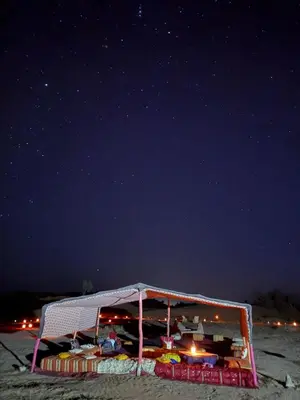 a soccer goal on the beach at night at Camp azmamar in Mhamid