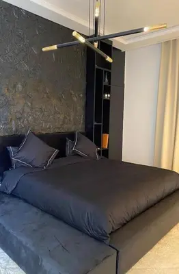 a bedroom with a large bed in a room at Villa M avec Piscine Chauffée in Marrakech