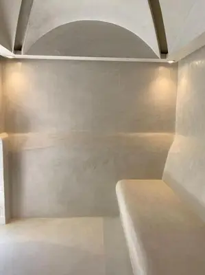 a white bathroom with a bench in a room at Villa M avec Piscine Chauffée in Marrakech