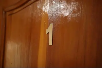 a wooden door with the number one on it at Fes apartment in Fès