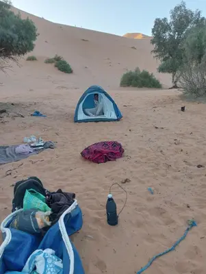 a person in a tent in the desert at Canadien camp merzouga in Merzouga