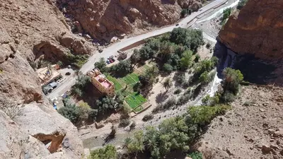 an aerial view of a house on the side of a mountain at Hotel De La Vallée in Aït Baha