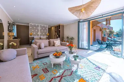 a living room with a couch and a table at Villa Naël Marrakech in Marrakech