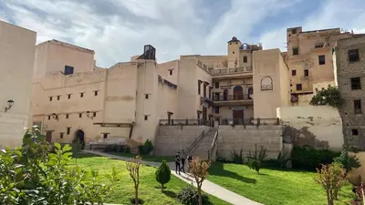a large building with people walking in front of it at Dar Lalla Yedouna Chez Charifa in Fès