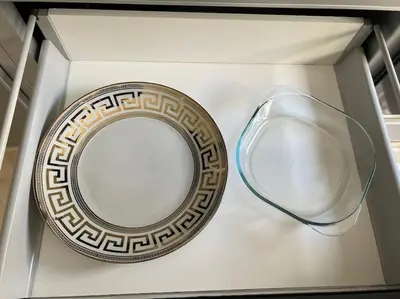 a mirror and a pair of glasses on a wall at Appartement luxueux à Fès in Douar Oulad Mhammed