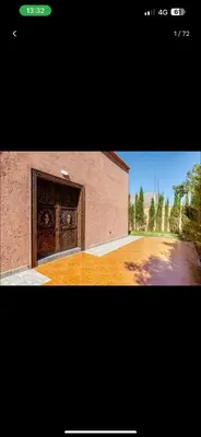 a picture of a building with a large door at Villa wafai in Srarhna