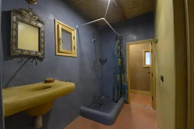 a bathroom with a sink and a shower at Guest farm Oulad Chmicha in Bir el Kelb